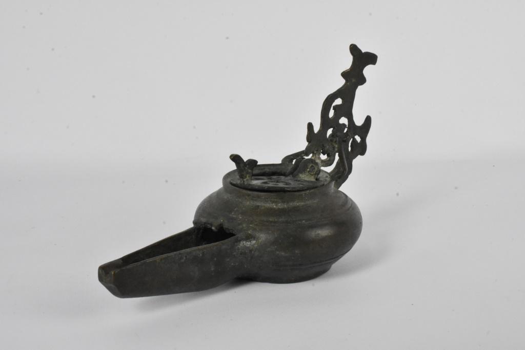 Antique Middle Eastern Oil Lamp: From a local estate. Measures approx. 2"h by 7"l
