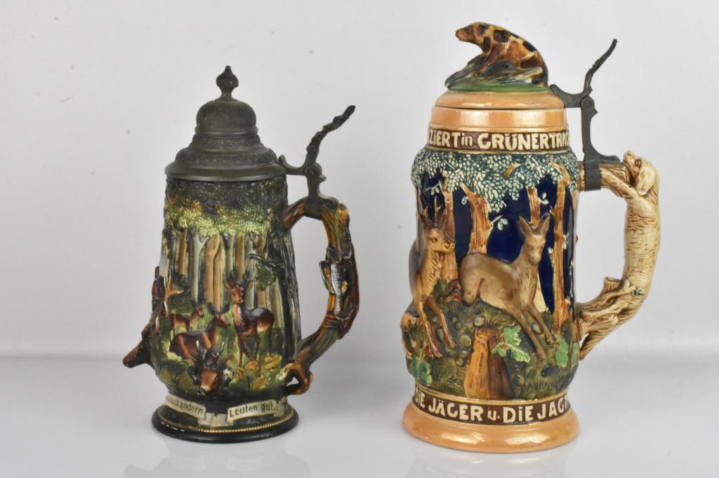 German Beer Stein Grouping: Grouping includes (2) vintage German beer steins featuring hunting scenes, including (1) gesetzlich geschützt beer stein marked 1274 and (1) stein with the phrase "Die Walder Die jager Die Jagt (The