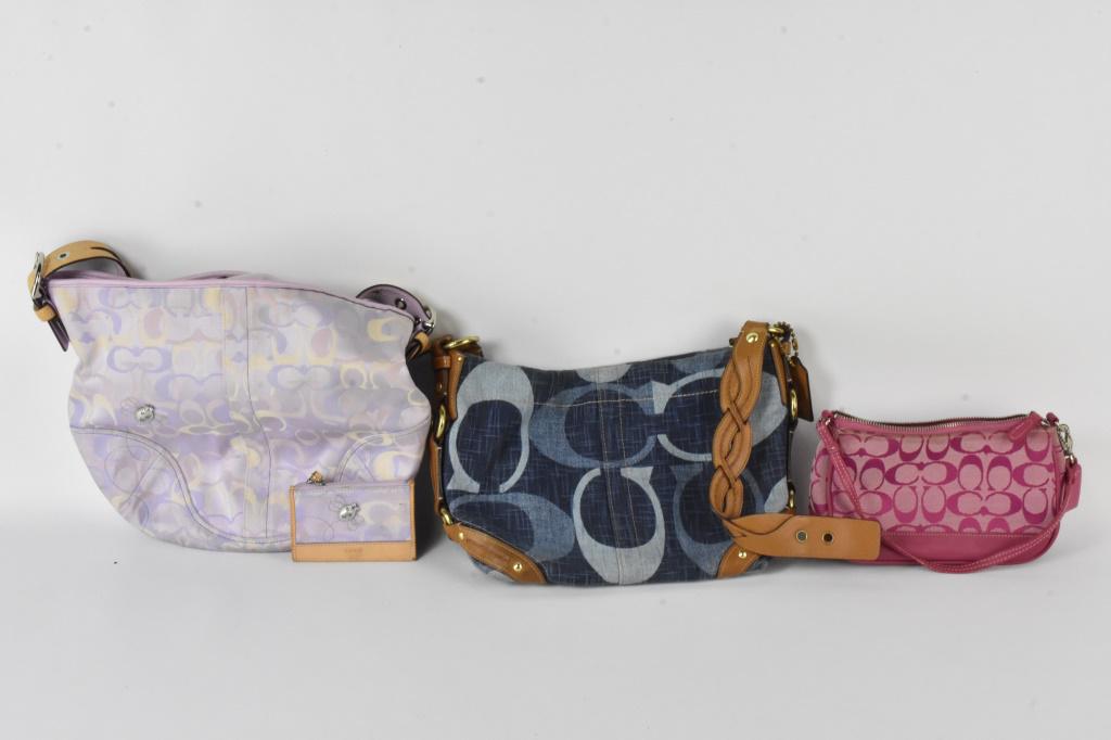 Coach Purse Grouping: Grouping includes (3) Coach bags including a Coach purse style no. 53-5-65, a Coach no. A0826-12197, and a small Coach purse no. J4D-6094. Largest measures approx. 11"h by 12"l