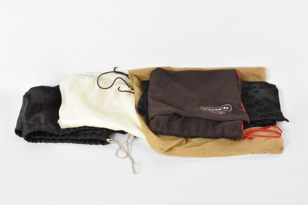 Louis Vuitton Purse Dust Bag Grouping: Grouping includes (6) dust bags from makers including Coach, Gucci, and Louis Vuitton. Largest measures approx. 14"h by 18"l