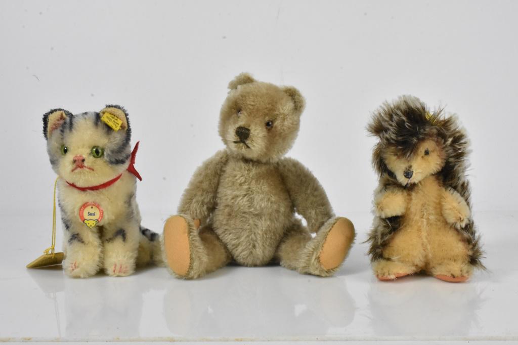 Steiff Animal Grouping: Grouping includes (3) Steiff animals including a cat named Susi with original labels, tags, and ear button; a bear is attributed to be Steiff and does not have ear button, and a porcupine with ear but