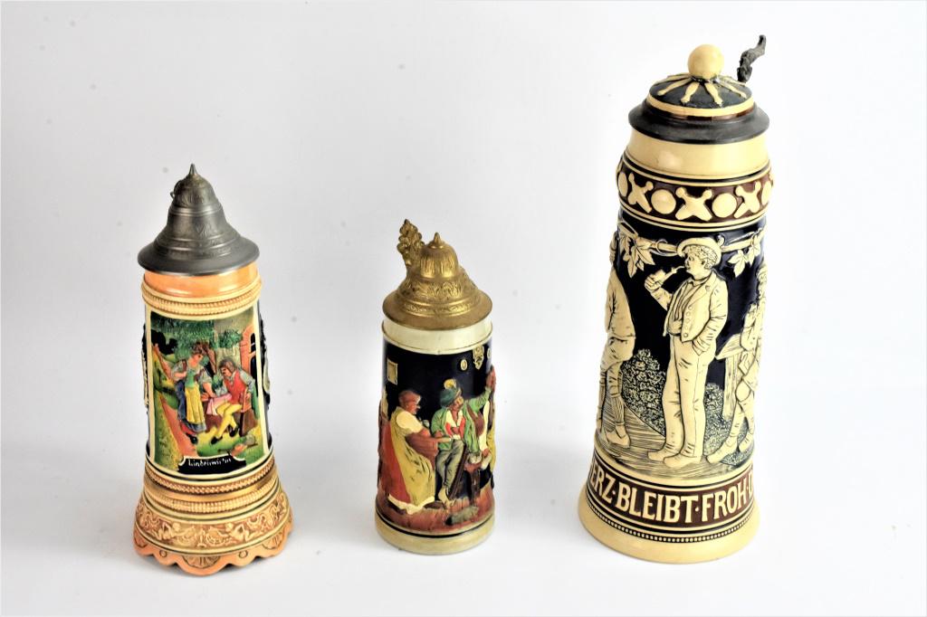 German Beer Stein Grouping: Includes: (3) Antique Beersteins, tallest measuring: 15", ball was reattached, and older possible original repair.