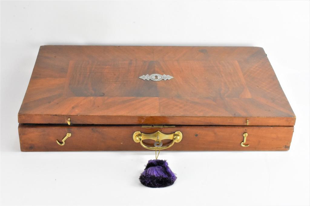 Antique German Zither in Fitted Case: An antique German zither in a fitted case. Zither appears to be constructed of rosewood. Comes with lock and key, but lid of case is warped. Case measures approx. 24" by 14"