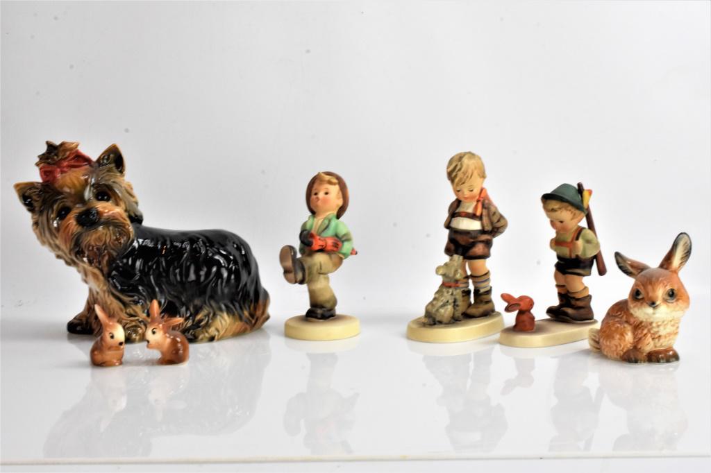 Hummel and Goebel Porcelean Grouping: Includes a Goebel Yorkie, 3 Goebel bunnies, 3 Hummel figures. Yorkie measures 8" long and 6" high, and tallest Hummel measures about 5" high.