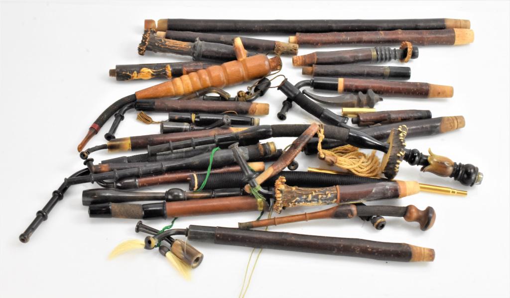 Antique German Pipe Grouping: German pipe parts grouping. includes over 20 flutes in various conditions in various woods. Includes some that are adorned with stag antler and other carved with elk.