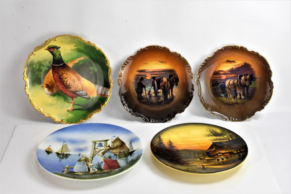 French Limgoe Porcelean Charger Grouping: 2 chargers depicting farm life with horses made in Bolgaria, a Majolika charger depicting a tudor house with chickens, 4th charger marked Germany depicting people on the waters edge with sailboats in 