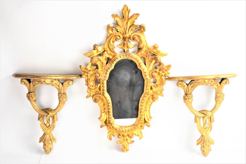 Carved and Gilt Wood Mirror Grouping: Grouping includes (2) carved and gilt wood wall brackets and a carved and gilt wood mirror. Wall brackets measure approx. 11.5"w and 13.5"h and the mirror measures approx. 25"h by 15"w