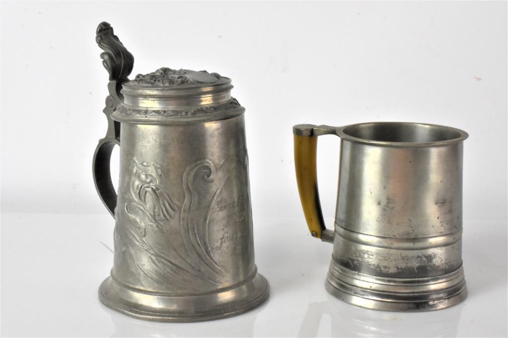 Antique Stein Grouping: Grouping includes (2) antique steins including (1) antique German beer decorated with irises and engraved with the town of Forchheim and the date of 1911. Also included is an vintage John Somers Brazi