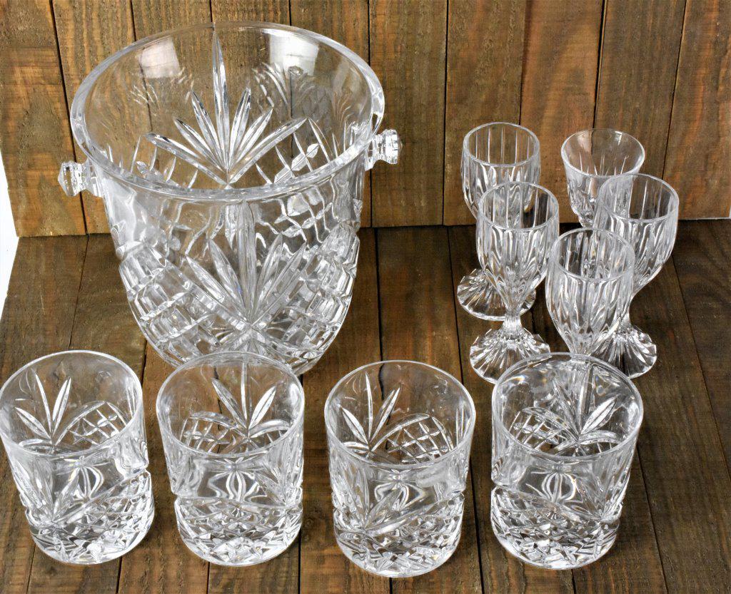 Cut Glass Grouping: Grouping includes (13) pieces including (1) cake plate, (2) candlesticks, (4) brandy glasses, (1) ice bucket, and (4) glasses.