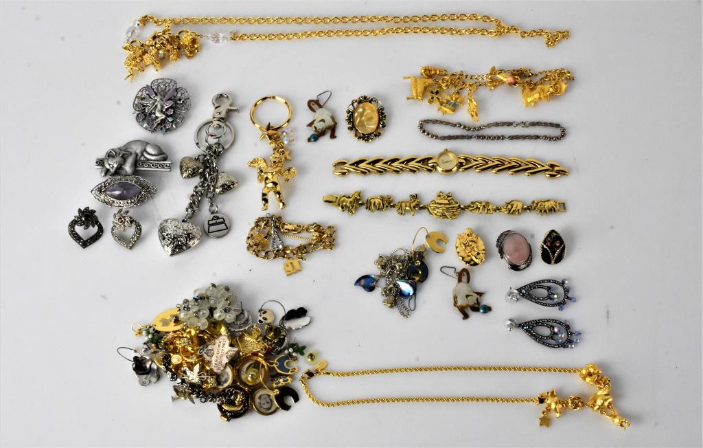 Costume Jewelry Grouping: Grouping includes necklaces, bracelets, earrings, brooches, locket, and charm bracelet.