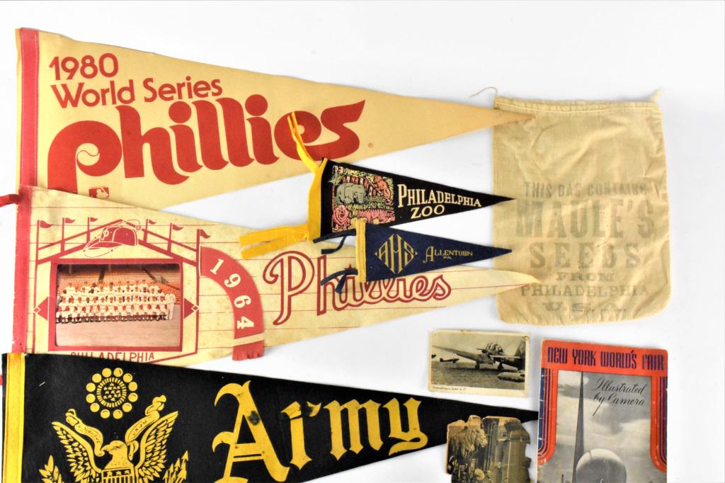 Ephemera and Pennant Grouping: Grouping includes (9) pieces including (1) army pendant, (1) 1964 Phillies pendant, (1) 1980 World Series Phillies pendant, (1) Maule's Philadelphia, PA seed bag, (1) Philadelphia Zoo pendant, (1) All
