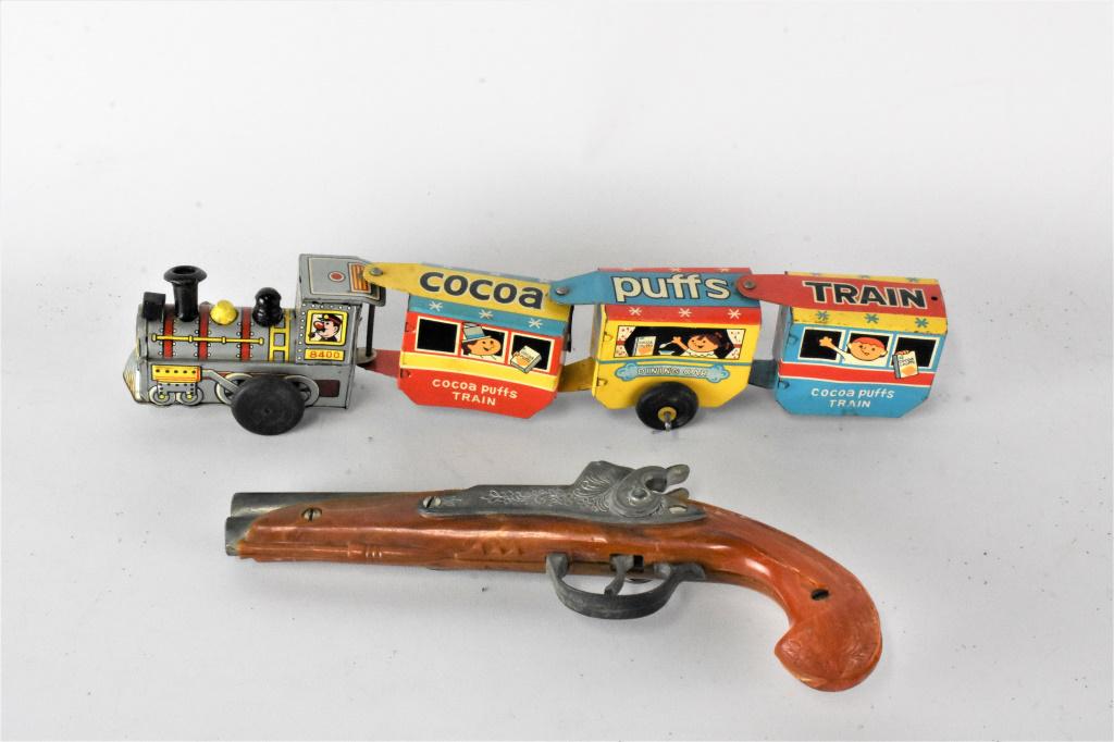 Vintage Toy Grouping: Grouping includes a Line Mar Toys Coco Puffs train #8400 and a Hubley toy flintlock pistol.