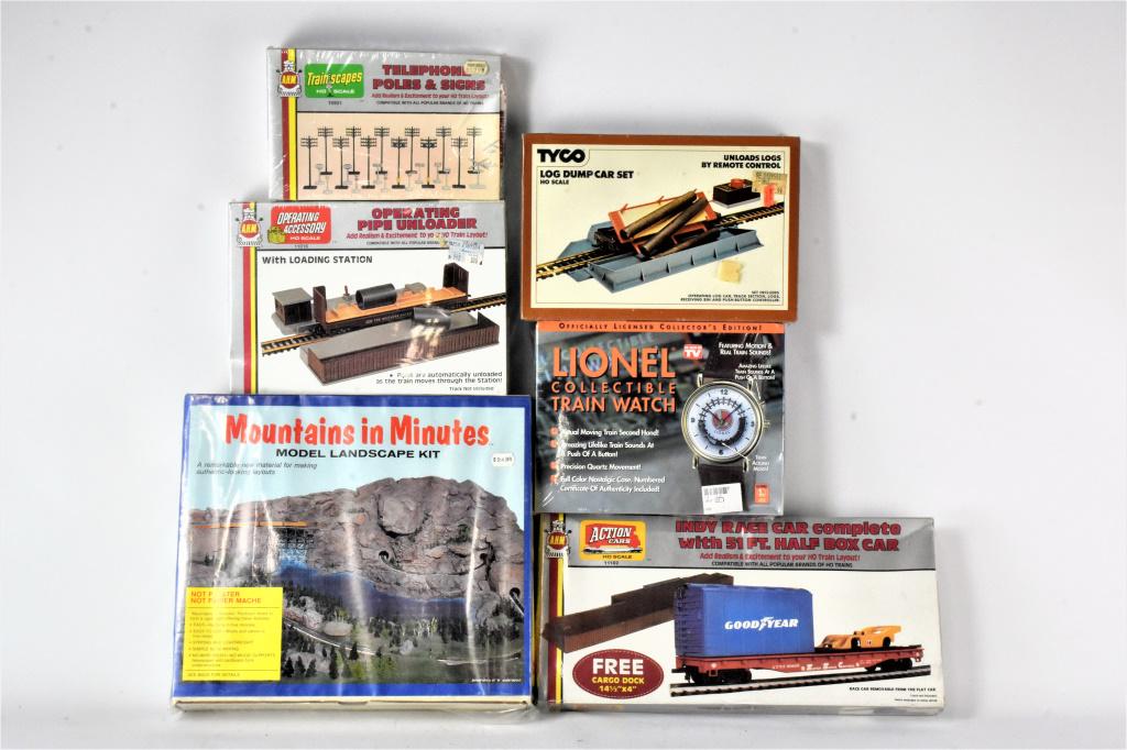 A.H.M Train Accessory Grouping: Grouping includes (6) pieces including A.H.M models #15901, #11016, and #11102. Also includes Tyco #926, a Mountains in Mintues model landscape kit, and a Lionel collectible train watch. All pieces ar