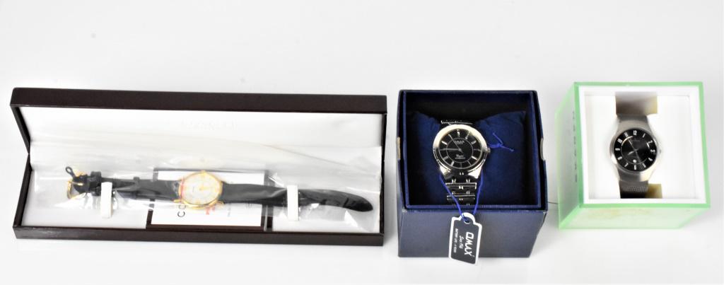 Watch Grouping: Includes: (3) watches including: Coach watch-Serial #: 0804, 6.836.354, Omax Quartz watch, and (1) skagen Denmark watch marked titanium #533LTTM