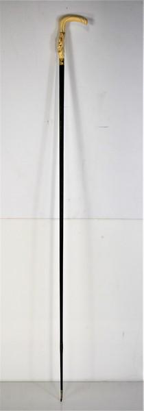 Antique Bone & Gold Washed Cane: Shaft appears to be ebonized Measures approx. 34.25"l, bone section measures approx. 3.75"l
