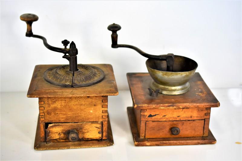 Antique Coffee Grinder Grouping: Grouping includes (2) antique coffee grinders, the largest of which measures approx. 7" by 7" by 6.5"