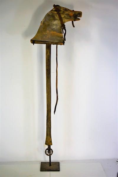 Antique Child's Toy Riding Horse: In unusual form with mono wheel, circa 19th century in as found condition, measures approx. 38.5"h, not including stand