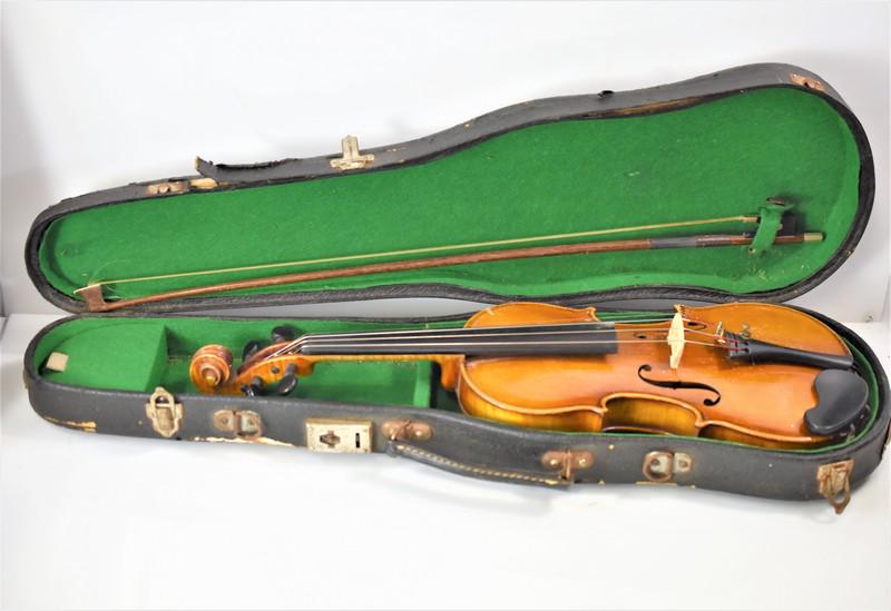 Antique German Violin Stradivarius & Bow: Includes an antique Violin with hard case and vintage bow, the interior label marked Copy of Antonius Stradivarius faciebat Cremona 1713 made in West Germany. Violin measures approx. 21.5"l by 8"w. Bo