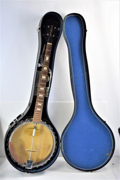 Antique Gibson / Homer / Amar K Haas Banjo: As found in the estate, measures approx. 38"l by 13.5"w.Appears to be in excellent condition, nothing appears to be damaged or broken. Is marked on the inside with "Gibson Dinatone Guarantee." Made in