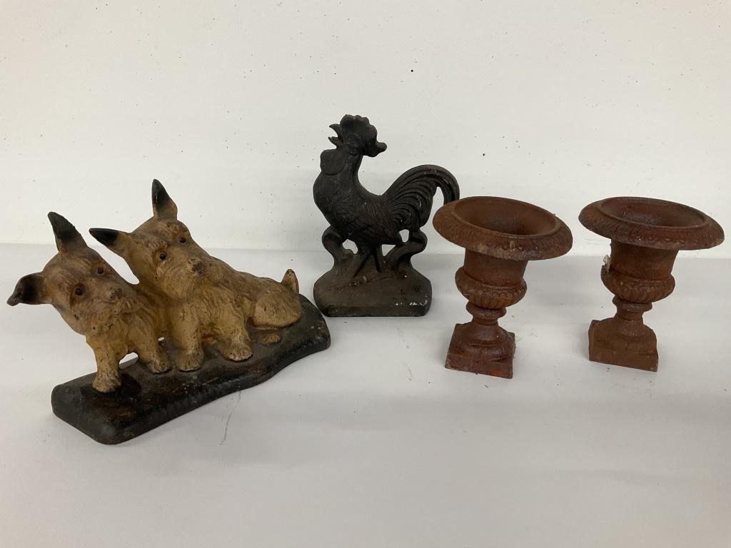 Cast Iron Door Stops & Collectibles: Roofing includes four pieces of cast-iron for home decor. Twin terrier doorstop, chicken doorstop, and two small rusted urns. Twin terriers measure approximately 9 inches long by 6 inches tall. Chicke