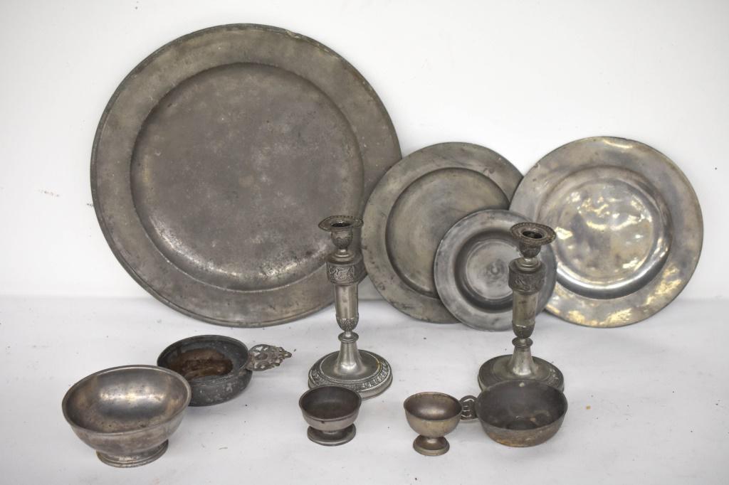 Antique Pewter Collection: Grouping Includes (10+) Pewter Kitchenware Pieces, Including (2) Wine Tasters. Largest plate / charger measures approx 15" in diameter. Some Pieces Are Either Signed Or Hallmarked. All As Found In The
