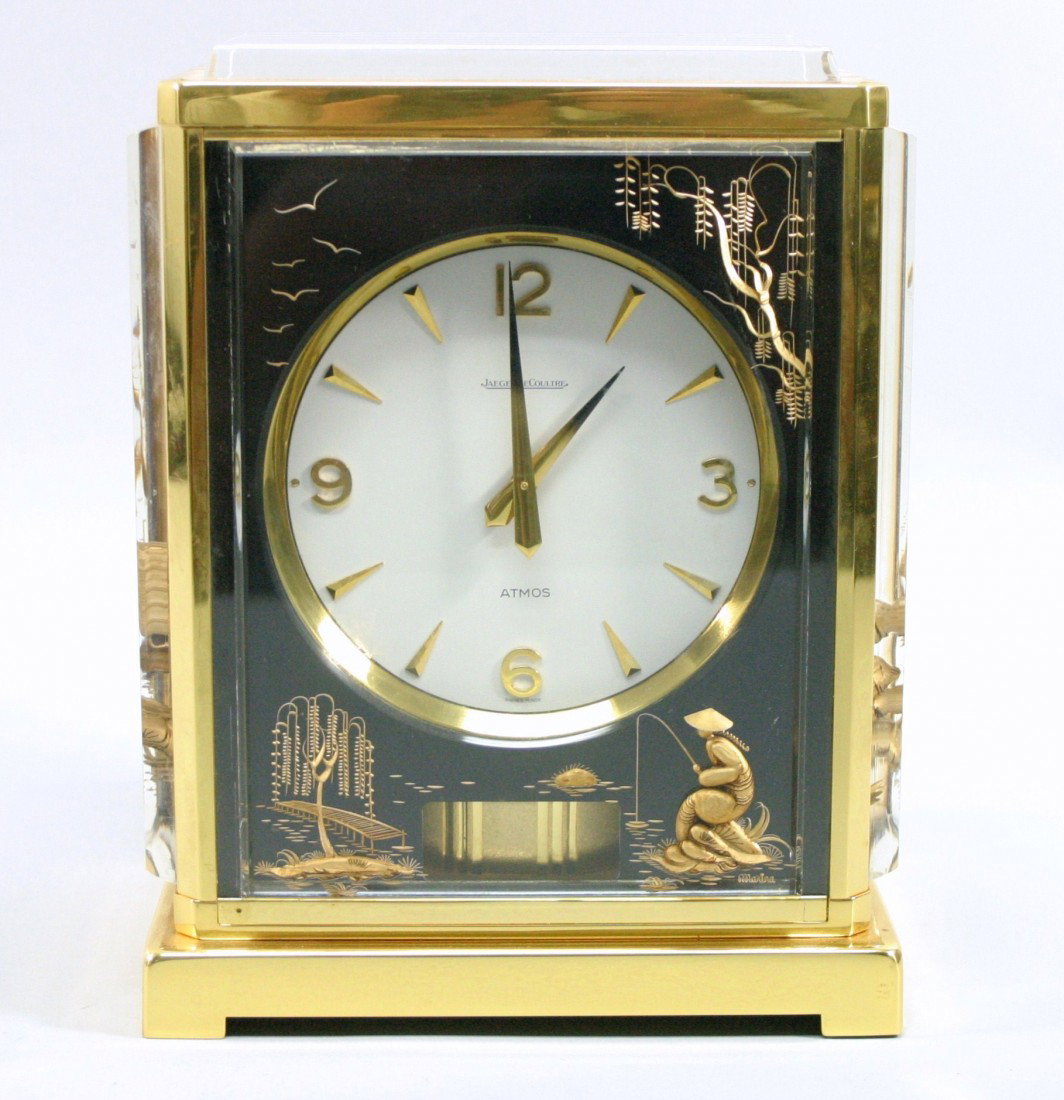 Jaeger Le Coultre Atmos Marina Clock: Jaeger LeCoultre black marina Atmos clock with a oriental design. Enchanting clock. Mounted stylized lucite panels with oriental or Asian design. Movement wound by barometric pressure. Front panel hav