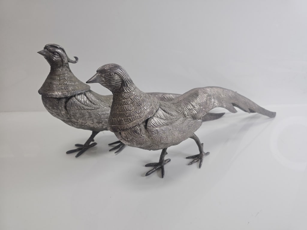 Pair of Antique Silver Plated Italian Pheasants: Pair of silver plated Pheasant figurines measuring approx. 9" tall x 21" long, marked Italy on foot