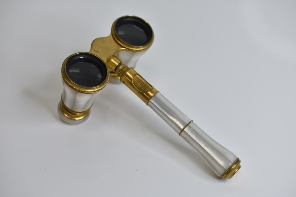 Lemaire Paris French Opera Glasses: Pair of Lemaire Paris French Opera Glasses, there is a crack in the mother of pear as seen in the photos, however, it is in near perfect condition otherwise and is beautifully done with Mother of Pear