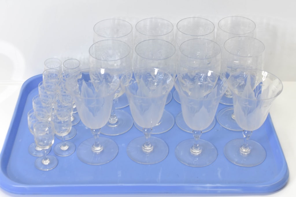 Dorflinger Family Cut Glass Collection: Grouping includes (23) glasses total including (8) large glasses measuring approx. 6.25"h x 2.75"w; (4) medium glasses measuring approx. 5.75" x 3.25"w; and (11) small glasses measuring approx. 3"h x