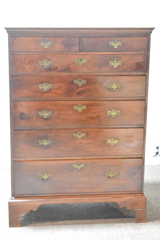 Antique Chippendale High Chest 1790-1820: Chest with two drawers over five graduated drawers resting on bracket feet. It retains it's bat wing brasses. Measurements 10" x 40â€œ x 56â€œ