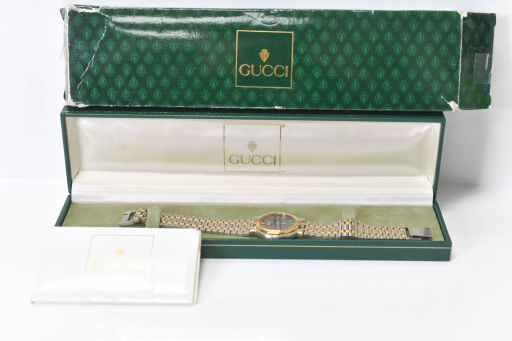 Vintage Gucci 9000m Mens Watch: Includes a vintage Gucci 9000m mens watch with a slate gray face. In original case, working condition unknown.