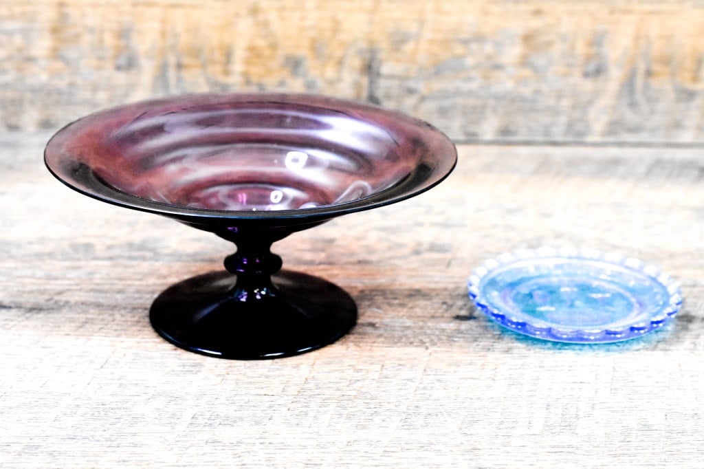 Dorflinger Family Cut Glass Collection: Dorflinger Glass Museum White Mills PA Pairpoint Glass Cup Plate (6 1/2" dia.). Dorflinger Hand Blown Amethyst Glass Compote (3 1/2" dia,). From the Dorflinger Family Glass Collection. Provenance: Dir