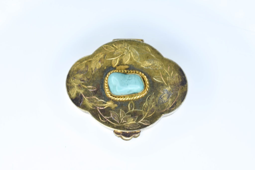 Chased Silver Vermeil Jade Pill Box: Chased decorated lid with jade jadeite, underside marked "Silver", gold wash, 0.65 ozt, measures 1 7/8" long.
