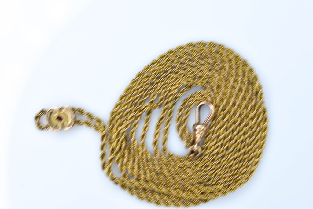 Watch Chain and Slide: Gold-filled 49" rope chain with a gold-filled slide centered with a red glass stone