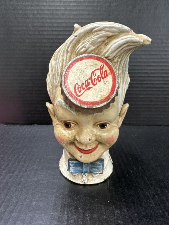 Coca-Cola Cast Iron Still Bank Sprite Boy: Vintage Coca-Cola Sprite Boy Bottle Cap still bank made from cast iron some paint loss from age. Measures about 9 inches high.