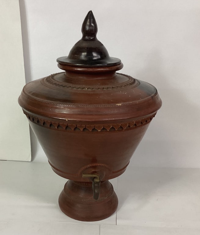 Vintage Terracotta Clay With Lid And Spigot: Carved decorative designs. Shows some minor chips on lid and very minor light scuffs. Measures approx. 19"x14???