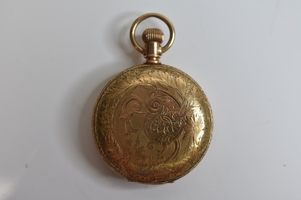 14K Gold Filled Waltham Hunter's Case Pocket Watch: Includes a Crescent Watch Case Co scroll and floral decorated gold-filled hunting case #326136 houseing an American Waltham movement #4923599, 7 jewels, size 6. Not tested for working condition.