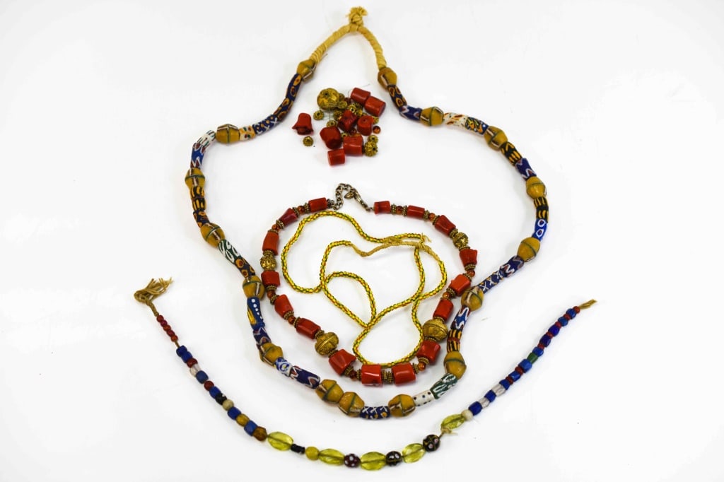 Vintage Middle Eastern African Necklace Lot: Grouping includes (4) necklaces and misc. beads. Largest necklace measures approx. 15.5"l All items are in as found condition from estate.