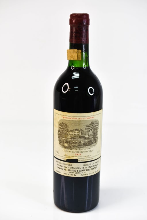1975 Chateau Lafite-Rothschild Bordeaux Wine: Includes a Chateau Lafite Rothschild, Vintage 1975, Appellation Pauillac Bordeaux, 750 ml. This fine wine is part of an estate. It was stored and located in a dry dark temperature-controlled environme