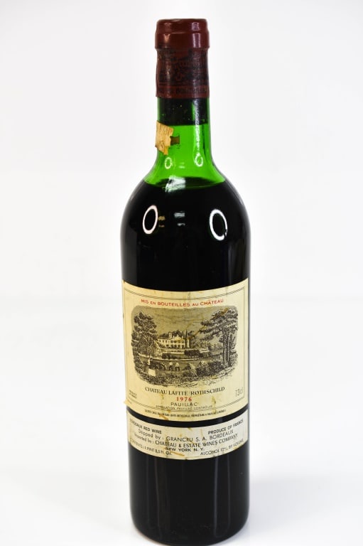1976 Chateau Lafite-Rothschild Bordeaux Wine: Includes a Chateau Lafite Rothschild, Vintage 1975, Appellation Pauillac Bordeaux, 750 ml. This fine wine is part of an estate. It was stored and located in a dry dark temperature-controlled environme