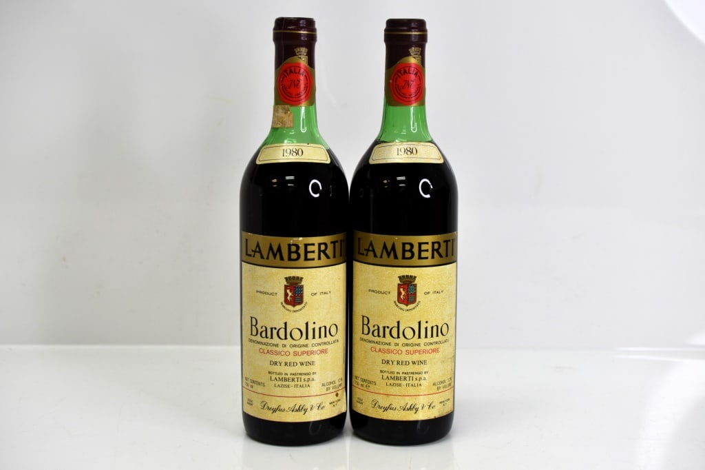 1980 Lamberti Bardolino Classico Superiore Wine: Grouping includes (2) bottles of 1980 Lamberti Bardolino Classico Superiore Dry Red Wine. This fine wine is part of an estate. It was stored and located in a dry dark temperature-controlled environmen