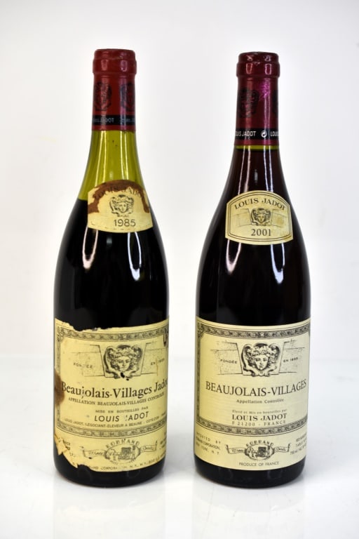 Louis Jadot Beaujolais Villages Wine: Grouping includes (2) bottles of Louis Jadot Beaujolais Villages red wine dated 1985 and 2001. This fine wine is part of an estate. It was stored and located in a dry dark temperature-controlled envir