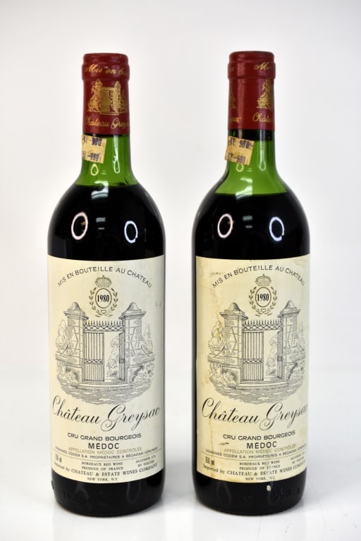 1980 Chateau Greysac Wine: Grouping includes (2) bottles of 1980 Chateau Greysac red wine. This fine wine is part of an estate. It was stored and located in a dry dark temperature-controlled environment. We are not wine experts