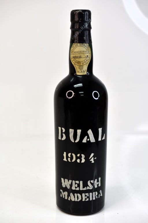 1934 Welsh Brothers Bual Wine: Includes (1) bottle fo 1934 Welsh Brothers Bual Vintage dessert wine. This fine wine is part of an estate. It was stored and located in a dry dark temperature-controlled environment. We are not wine e
