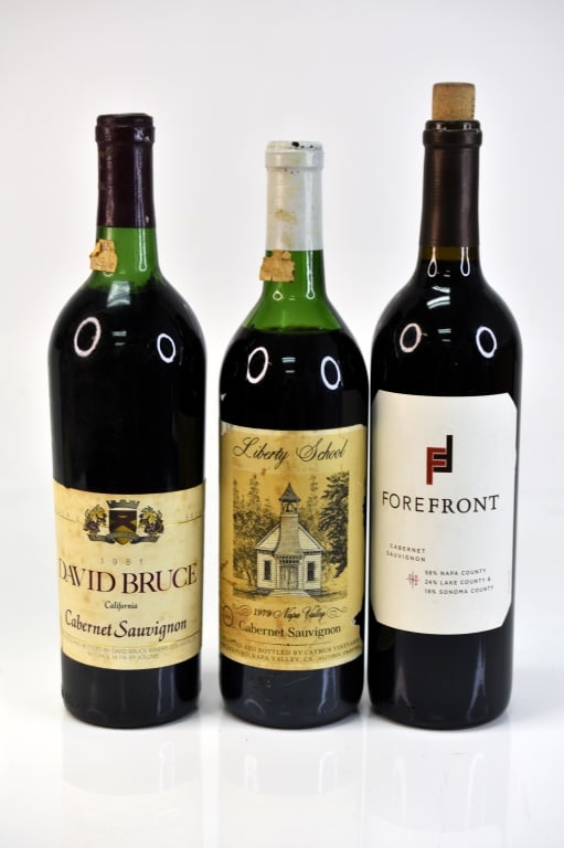 Liberty School Cabernet Sauvignon Wine & More: Grouping includes (3) Cabernet Sauvignon wine bottles including (1) 1979 Liberty School Napa Valley Cabernet Sauvignon, (1) 1981 David Bruce California Cabernet Sauvignon, and (1) 2012 Forefront Caber