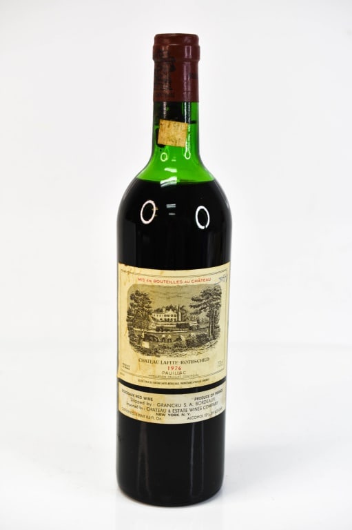 1976 Chateau Lafite-Rothschild Bordeaux Wine: Includes a Chateau Lafite Rothschild, Vintage 1976, Appellation Pauillac Bordeaux, 750 ml. This fine wine is part of an estate. It was stored and located in a dry dark temperature-controlled environme