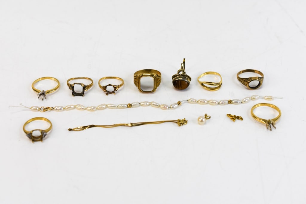 Scrap Gold Rings and Bracelet 23.6 Grams: Includes (7) 14K gold rings (marked or tested); (1) gold bracelet and pearl bracelet, as well as pearl pendant, are marked 14K. The pearl pendant also has a small pave diamond. (2) additonal gold ring