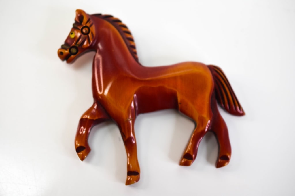 Cherry Bakelite Horse Pin Brooch: Brooch measures approx. 2.8"h x 2.87"w and is in good condition, with wear commensurate with age and use.