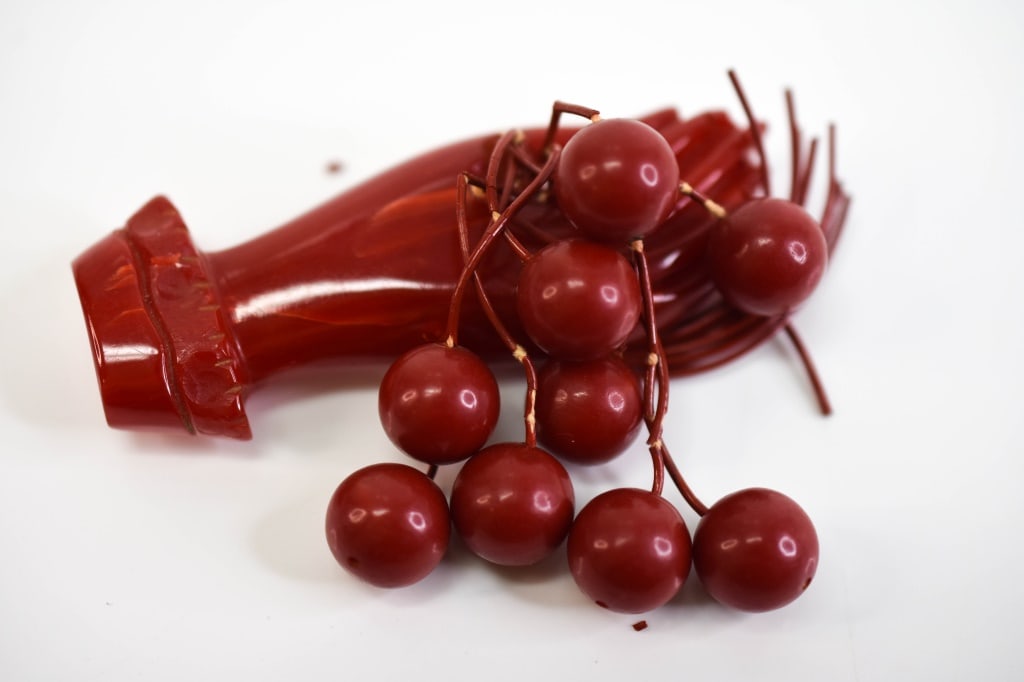 Bakelite Dangling Cherry Fruit Figural Hand: Bakelite appears to be in excellent condition with no visible chips, cracks, or breaks. Red stems do have some loss to the exterior. Measures approx. 3.06"w