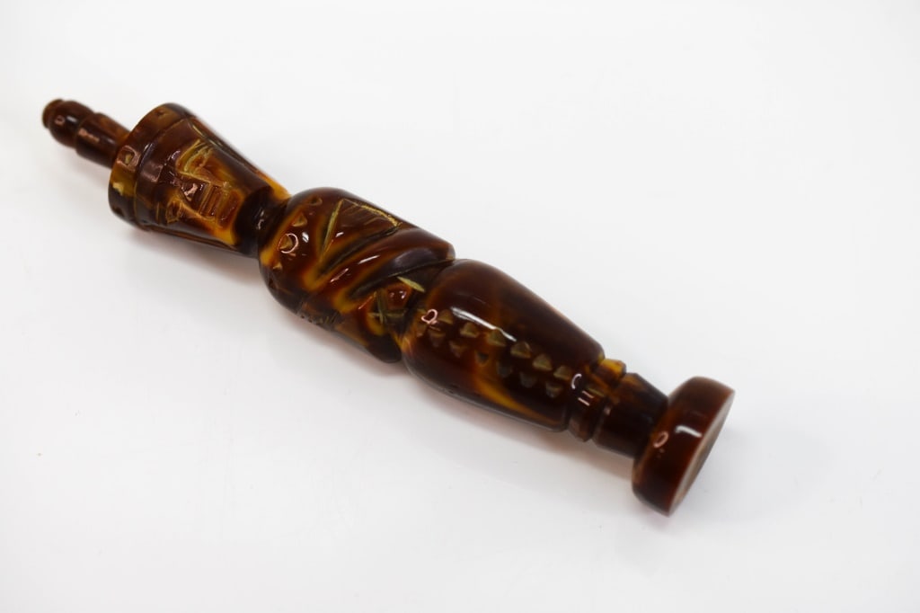 Brown Bakelite Mummy King Tut Perfume Bottle: Measures approx. 4.9"h, including perfume stem by 0.85"w. Bottle appears to be in good condition, with minor wear commensurate with age and use.